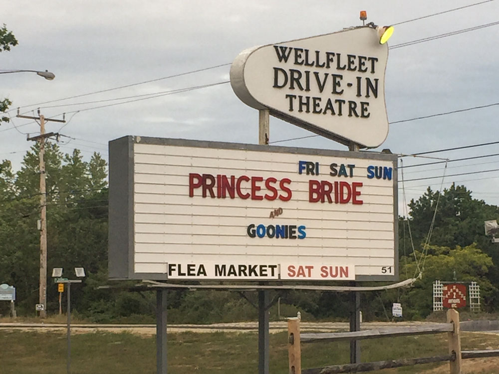 entrance sign to the wellfleet drive-in theater